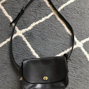Black cross body vintage coach bag.